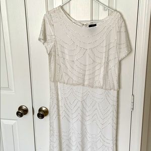 Adriana Papel white beaded gown